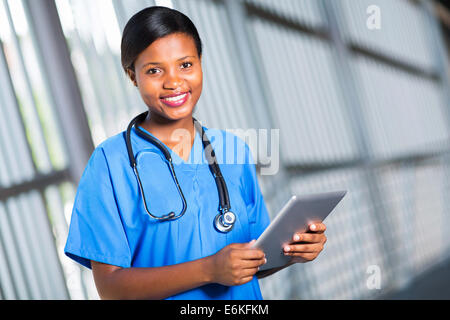 happy African doctor using tablet computer Stock Photo