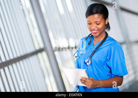 beautiful afro American nurse using tablet pc Stock Photo