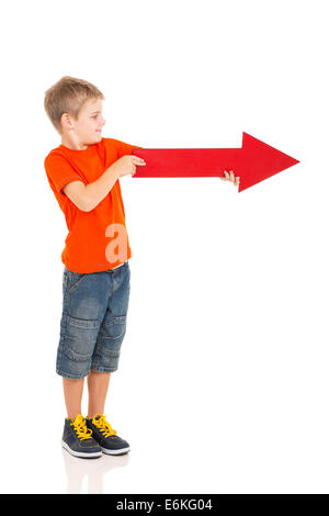 boy holding red arrow pointing right on white background Stock Photo