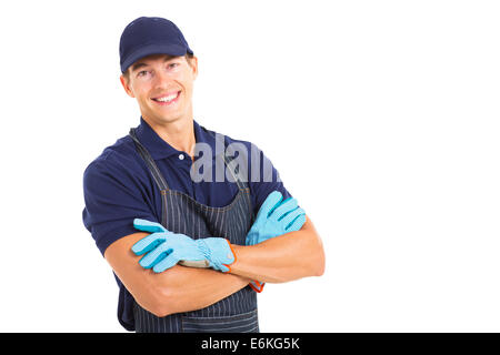 handsome young farmer wearing garden gloves isolated on white background Stock Photo