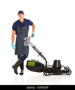 happy gardener standing next to a lawnmower isolated on white Stock Photo