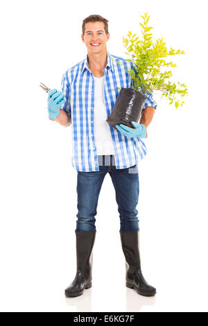portrait of young man with gardening tool and plant isolated on white Stock Photo