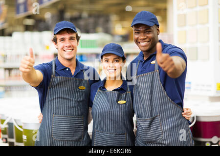 group hardware store workers giving thumbs up Stock Photo