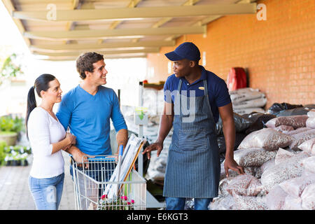 couple shopping for garden stones in hardware store Stock Photo