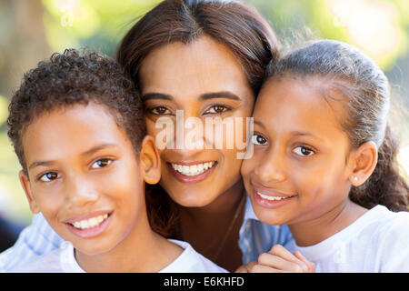 happy Indian mother and her adorable kids closeup portrait