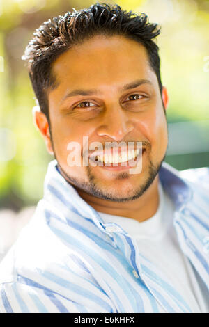 handsome Indian man close up portrait outdoors Stock Photo
