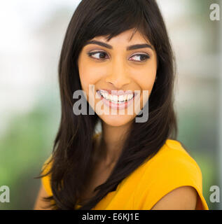 cheerful Indian woman smiling and looking aside Stock Photo
