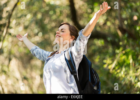 happy young woman taking deep breath in the jungle Stock Photo