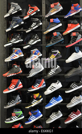 Colorful display of Adidas athletic shoes at Foot locker sporting goods store, on Broadway in Greenwich Village, New York City Stock Photo