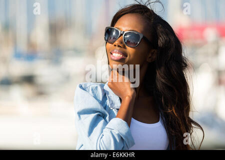 beautiful young African woman wearing sunglasses Stock Photo