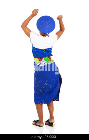 rear view of south African woman in traditional attire dancing Stock Photo
