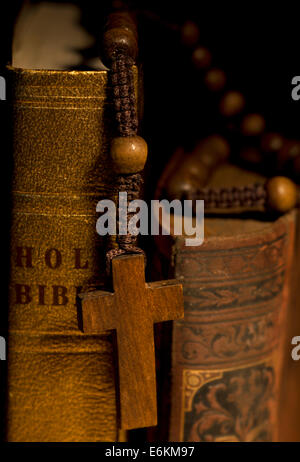 Old Holy Bibles and Wooden Rosary Beads. Stock Photo