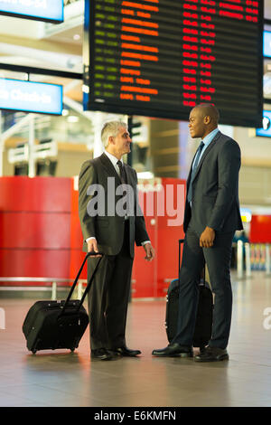 handsome businessmen in airport traveling together Stock Photo