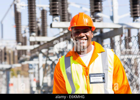 handsome young African electrical engineer at substation Stock Photo