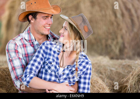 Attractive young couple in a barn Stock Photo, Royalty Free Image ...