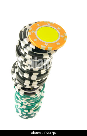 Stack of gambling chips isolated over white background. Focus on the top chips. Stock Photo