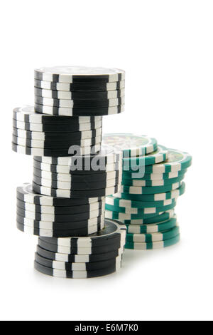Two stacks of casino chips isolated over a white background. Focus on the first stack. Stock Photo