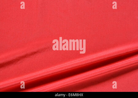 Red fabric background with space for text on top Stock Photo