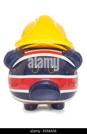 piggy bank wearing builders hard hat cutout Stock Photo