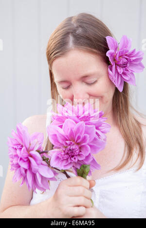 Portrait of woman with flowers Stock Photo