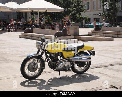 Yellow vintage Norton Commando 750 motorcycle parked on a square in Lons le Saunier, Jura region, France Stock Photo