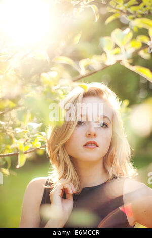 Portrait of young woman in forest Stock Photo