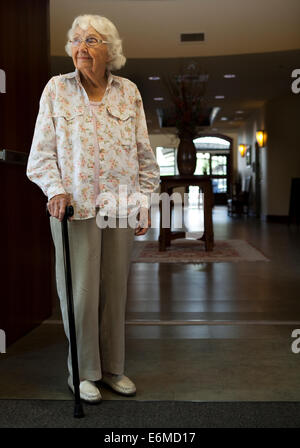 Elderly woman in retirement home Stock Photo