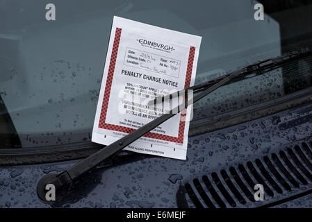 Parking ticket issued by Edinburgh City Council on a car windscreen. Stock Photo