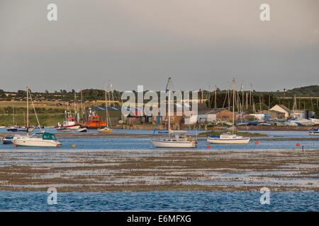 View of the east end of Wells harbour showing the tide encroaching on the saltmarsh. Stock Photo