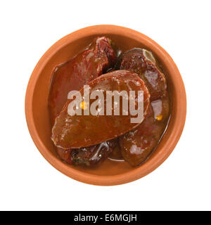 Top view of a serving of chipotle jalapeño peppers in tomato sauce in a small bowl. Stock Photo