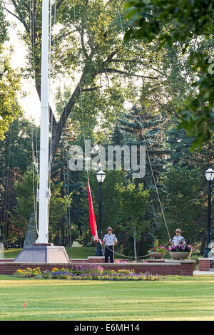 Dawn raising of the Canadian flag at the RCMP Depot cadet training academy in Regina, Saskatchewan, Canada. Stock Photo