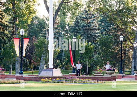 Dawn raising of the Canadian flag at the RCMP Depot cadet training academy in Regina, Saskatchewan, Canada. Stock Photo