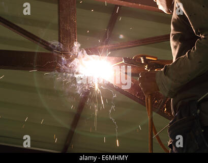 worker us electric welding connecting construction metal Stock Photo