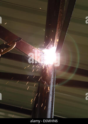 worker us electric welding connecting construction metal Stock Photo