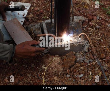 worker us electric welding connecting construction metal Stock Photo