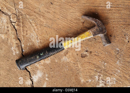 Old hammer on cement floor background Stock Photo