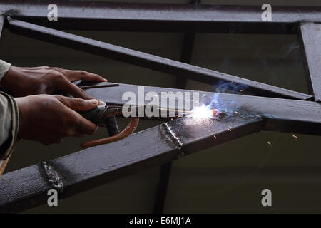 worker us electric welding connecting construction metal Stock Photo