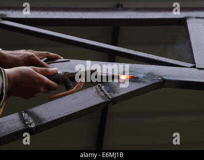 worker us electric welding connecting construction metal Stock Photo