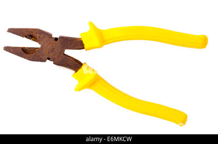 really old rusty pliers with yellow on white background Stock Photo