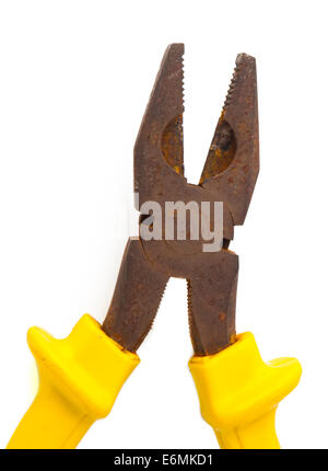 really old rusty pliers with yellow on white background Stock Photo