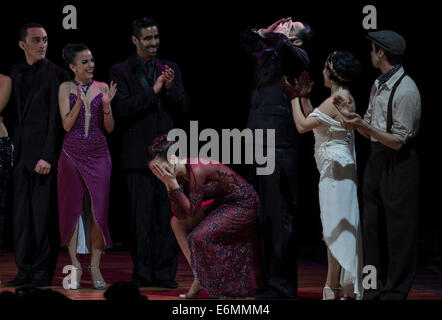 Buenos Aires, Argentina. 26th Aug, 2014. Manuela Rossi (C) and Juan Malizia Gatti (3rd R), react after winning the final of 'Escenario' (scenario) mode of the Tango World Championship, at Luna Park Stadium, of Buenos Aires City, Argentina, on Aug. 26, 2014. A total of 574 couples from 37 countries and regions attend the Tango World Championship. Credit:  Martin Zabala/Xinhua/Alamy Live News Stock Photo