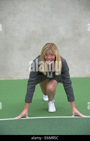 Businesswoman starting race ready set go position Stock Photo - Alamy