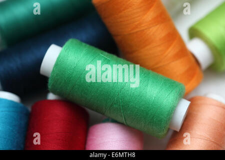 Colorful spools of sewing threads. Close-up. Stock Photo