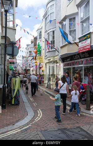 People walking through busy side street in Weymouth Dorset UK Stock Photo