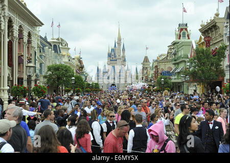 Crowds fill the main avenue leading from Cinderella Castle, Magic Kingdom Park, Walt Disney World, Orlando, Florida Stock Photo