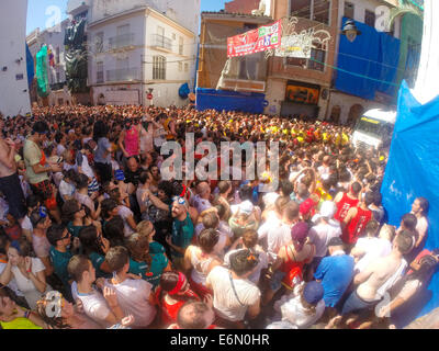 Bunol, Valencia, Spain. 27th August, 2014. A 20,000+ crowd, gathered from all over the world celebrates La Tomatina, Bunol's famous tomato throwing festival. The steets run red as around 40 metric tons of tomatos are thrown in one of the world's biggest food fights Credit:  James Wibberley/Alamy Live News Stock Photo