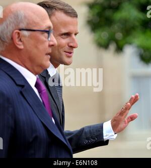 Paris, France. 27th Aug, 2014. France's new Economy Minister Emmanuel Macron (R) and French finance minister Michel Sapin leave after the weekly cabinet meeting in Paris, France, Aug. 27, 2014. France's Secretary-General of the Elysee Palace, Jean-Pierre Jouyet, unveiled on Tuesday France's new government headed by Prime Minister Manuel Valls, one day after the resignation of the former government. Credit:  Xinhua/Alamy Live News Stock Photo