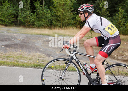 Individual Millennial man wearing Lycra racing in a bike cycle race organised by British Cycling at Fowlmead Country Park, Kent, England, UK, Britain Stock Photo