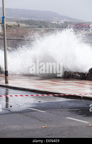 Huge waves crash through the sea wall during exceptionally high seas at Playa San Juan, Tenerife, Canary Islands, Spain. Stock Photo