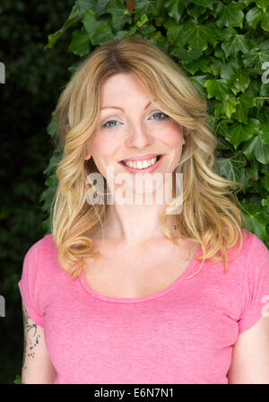 portrait of smiling young woman outdoors Stock Photo